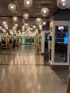 hall with hanging light bulbs in a food hall