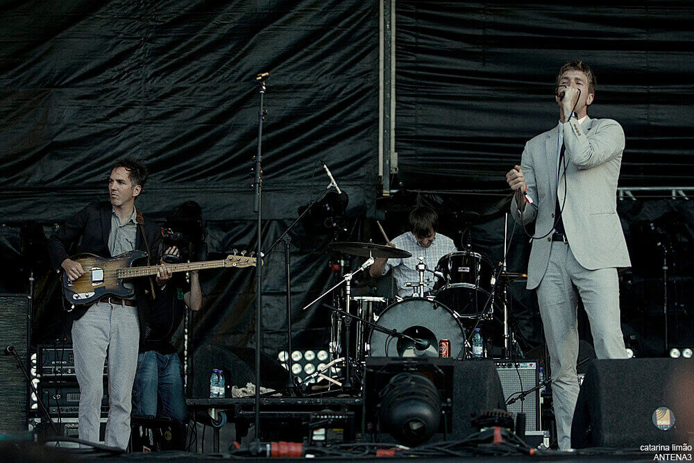 Three band members of the walkmen performing