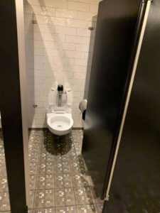 a toilet in a stall