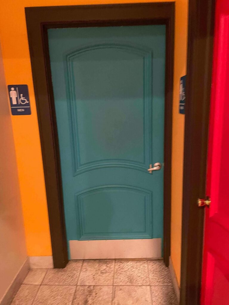 The green door of a bathroom