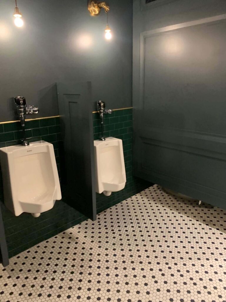 two urinals in a bathroom